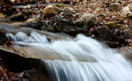 Snow thawing leads to education of mountain streamsの写真素材