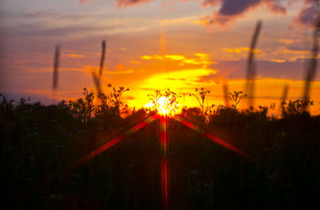 The sun goes down indicates the end of the day. Observed optical phenomena.の写真素材