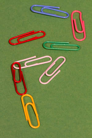 Bright cheerful pattern. Stationery chaotically scattered on a pale green background.の写真素材