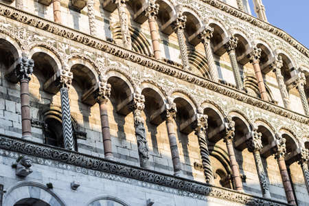 Architectural detail of columns of an antique church in the city center of Lucca, Tuscanyの写真素材