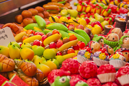 Bright and colourful fruitshaped candy in a marketの写真素材
