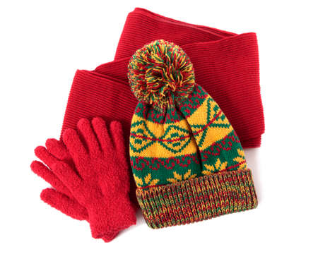 Winter hat, scarf and gloves against a white background.の写真素材