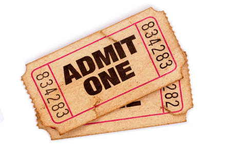 Old admit one tickets on a white background.の写真素材