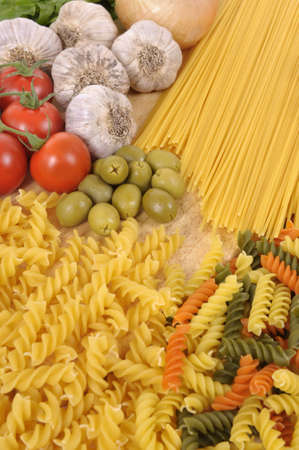 Selection of Italian spaghetti and pasta with garlic and olives.の写真素材
