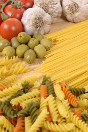 Selection of Italian spaghetti and pasta with garlic and olives.の写真素材