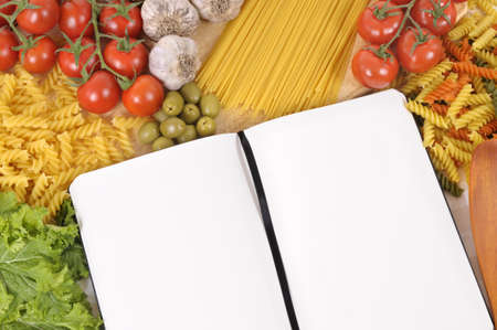 Selection of Italian spaghetti and pasta with blank recipe book or cookbook. Space for copy.の写真素材