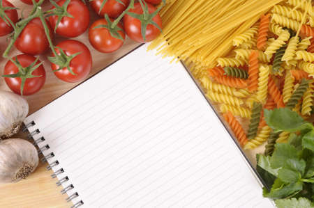 Selection of Italian spaghetti and pasta with blank recipe book or cookbook. Space for copy.の写真素材