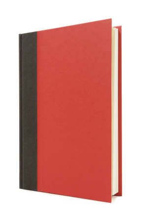 Red and black hardback book standing upright isolated on a white background.  Space for copy.の写真素材