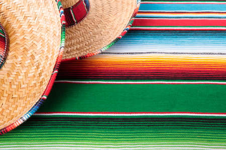 Mexican sombreros and traditional serape blanket.  Space for copy.の写真素材