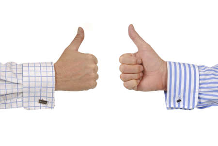 Two businessmen giving thumbs up signs.の写真素材