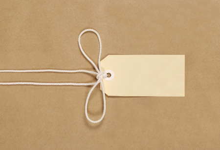 Brown paper parcel background with string and labelの写真素材