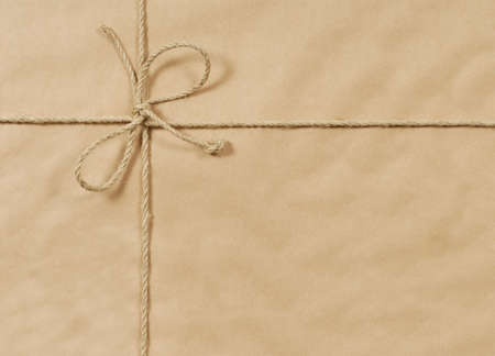Brown paper parcel background with string and copyspaceの写真素材