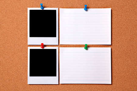 Blank photo prints and white message cards pinned to a cork notice board.  Space for copy.  Paths provided.の写真素材