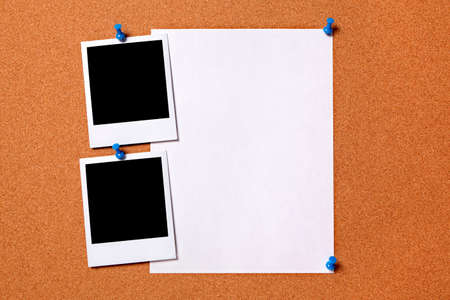 Blank photo prints and plain paper poster pinned to a cork notice board.  Space for copy.の写真素材