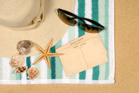 Seashore background with postcards shells beach towel and starfishの写真素材