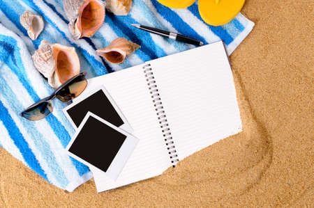 Beach background with blank photo prints, seashells, beach towel, flip flops and starfishの写真素材