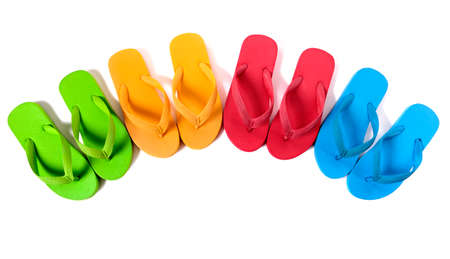 Row of colorful flip flops isolated against a white background.の写真素材
