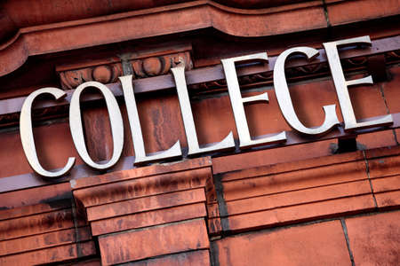 Sign above the entrance to a college building.の写真素材