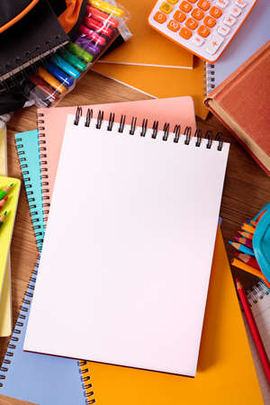 Student desk with blank writing book, copy spaceの写真素材