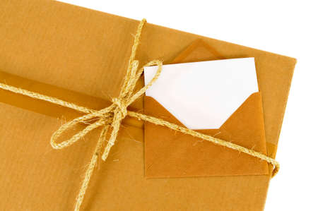 Cardboard box with rope and blank message cardの写真素材
