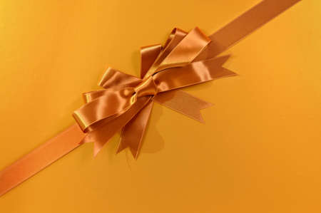 Gold gift background ribbon and bow diagonalの写真素材