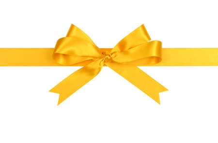 Yellow satin ribbon bow straight horizontal isolated on white backgroundの写真素材