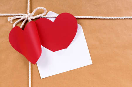 Valentine card or gift tag, brown paper package parcel, copy spaceの写真素材