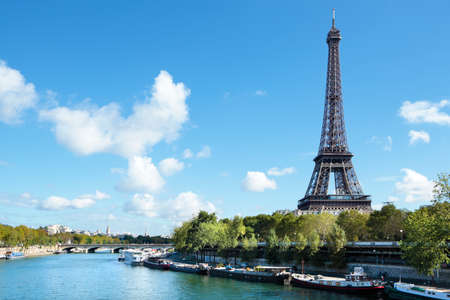Eiffel Tower distant horizontal landscape, river seine and boats, copy spaceの写真素材
