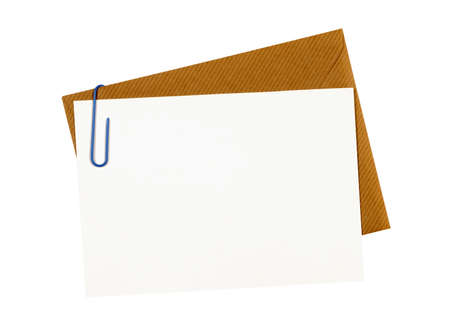 Brown manila envelope, blank letter or message card, paper clip, copy spaceの写真素材