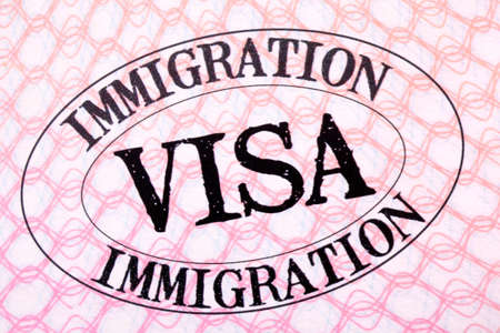 Immigration visa stamp passport page close up
