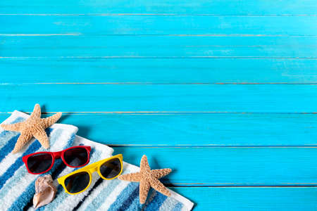 Summer beach background border, sunglasses, starfish, wood decking, copy spaceの写真素材