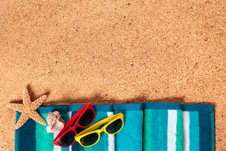 Summer vacation beach background border, sunglasses, sand copy spaceの写真素材