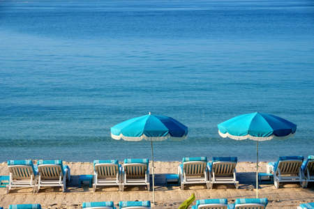 Beach resort umbrella and lounger
