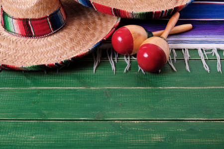 Mexico sombrero fiesta cinco de mayo wood background mexican maracasの写真素材