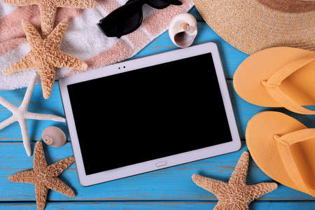 Tablet pc computer summer beach backgroundの写真素材