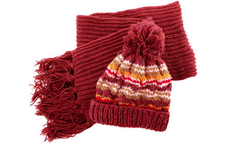 Chunky red knitted winter bobble hat scarf isolated white background