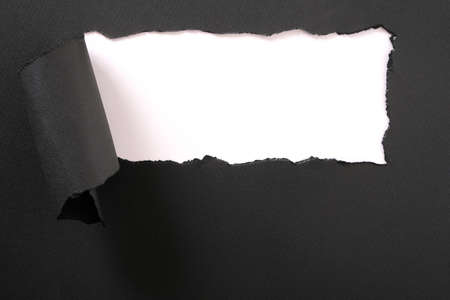 Torn black paper strip white background frameの写真素材