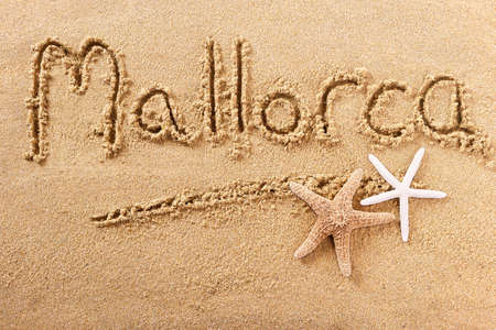 Mallorca majorca beach word sign message written in sandの写真素材