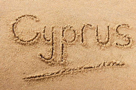 Cyprus beach word written in sand travel message conceptの写真素材