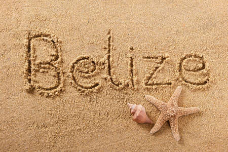 Belize beach word sign written in sandの写真素材