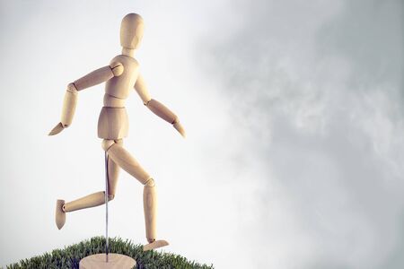 Artist wooden dummy runner in the fogの写真素材