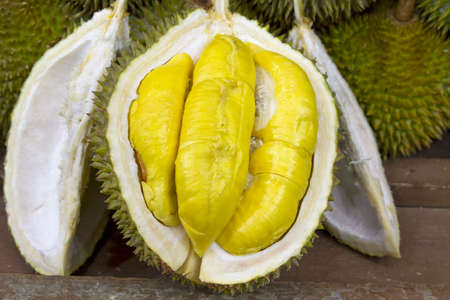 Durian open in display with yellow flesh on fruit stand in tropical country