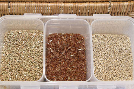 Organic Grains Display with Brown Rice Barley and Wheatの写真素材