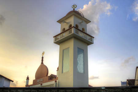 Muslim Mosque Temple in Singapore against Sunset Skyの写真素材