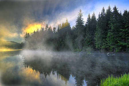 Sunrise and Reflection Over Trillium Lake Oregonの写真素材