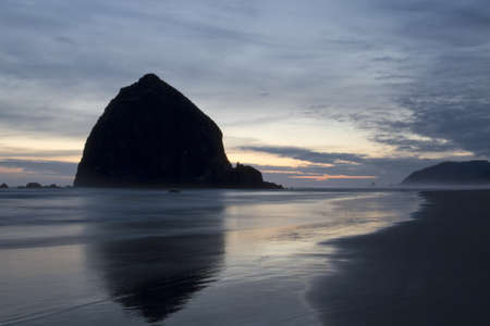 Haystack Rock on Cannon Beach at Oregon Coast after Sunsetの写真素材