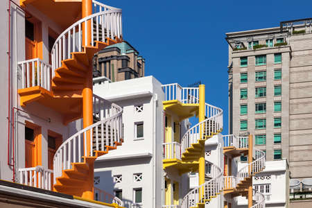 Colorful Row of restored spiral staircase in the back alleyway of Bugis Village in Singaporeの写真素材