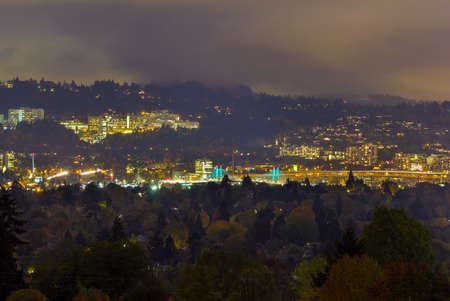 Marquam Hill Tilikum Crossing and Marquam Bridge in Portland Oregon during fall season one foggy nightの写真素材