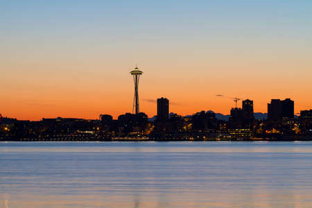 Seattle Washington city skyline silhouette during orange glow sunriseの写真素材