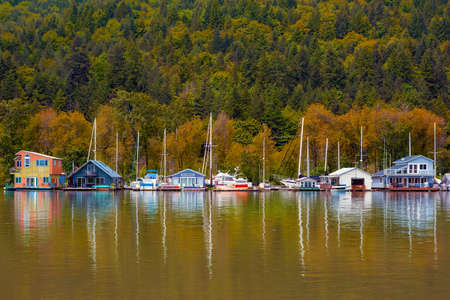 Flloating homes houseboats along Multnomah Channel in Portland Oregon in Fall Seasonの写真素材